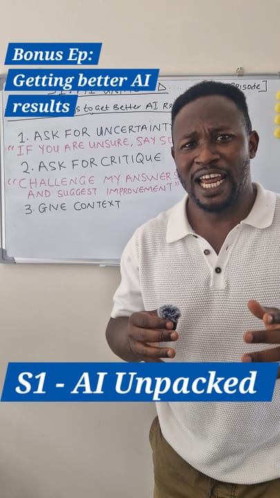 AI Unpacked, bonus episode: getting better AI results. Dr Kayode Omojola beside a whiteboard listing three techniques — ask for uncertainty, ask for critique, and give context.